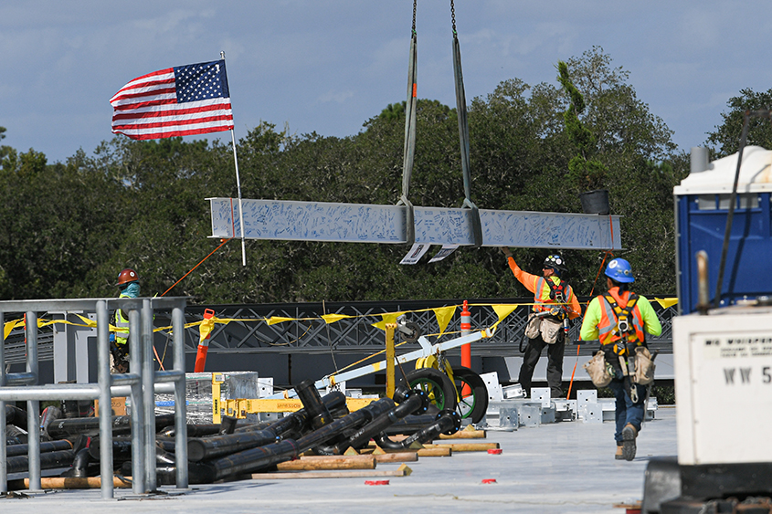 Topper beam being installed by crane