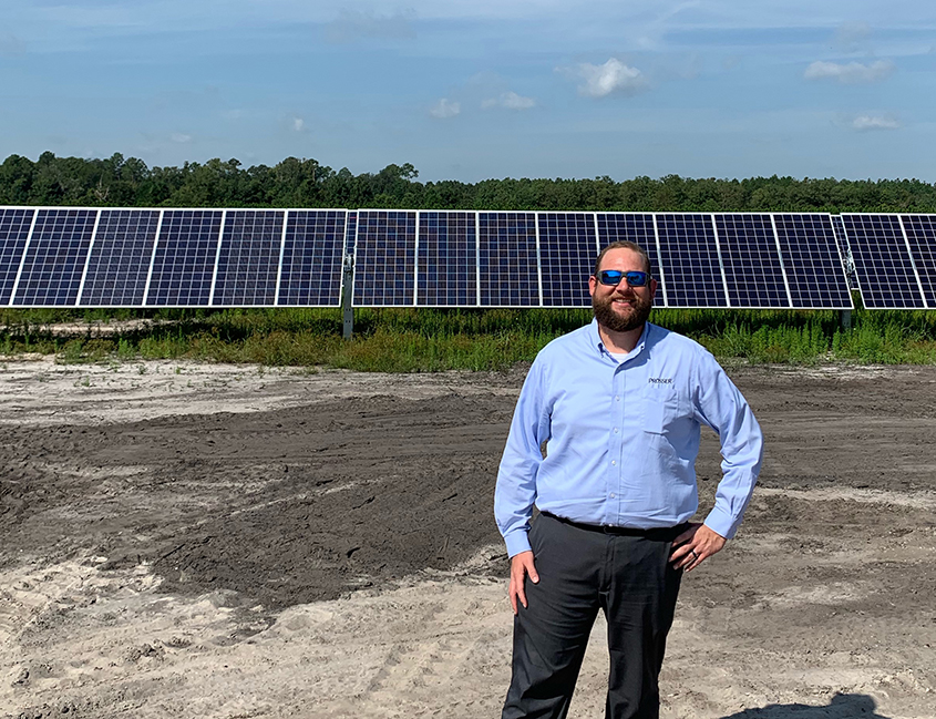 Tim O'Reilly in front of Solar Panels